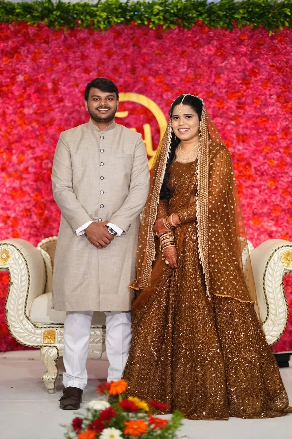 Fathima and Hasnad standing together in their engagement attire